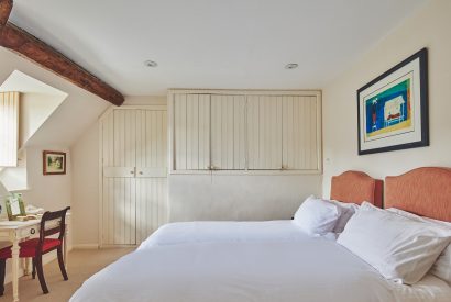 A twin bedroom at Withington Grange, Cotswolds
