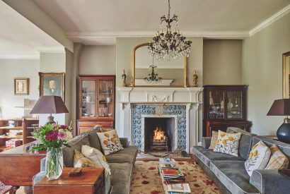 The living room with log burner at Roupel Hall, Devon