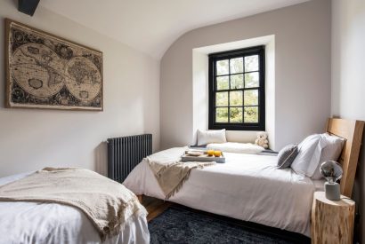 A twin bedroom at Padstone Farmhouse, Cornwall