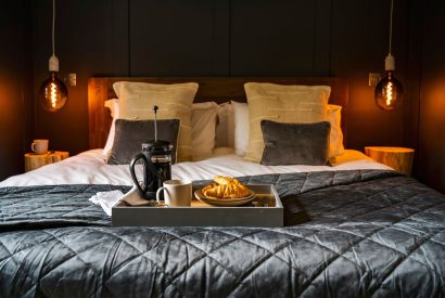 A double bed at Padstone Farmhouse, Cornwall