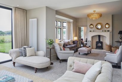 The living room with log burner at Lakeside Manor, Cotswolds