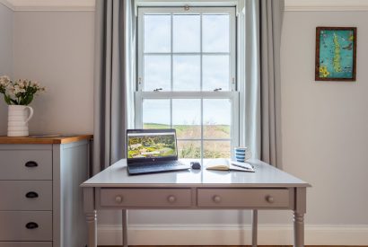 A desk with countryside view at Millook View Farmhouse, Cornwall