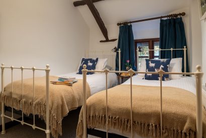 A twin bedroom at Partridge House, Devon
