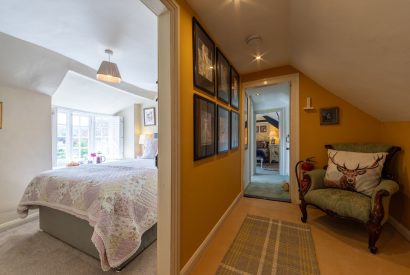A hallway leading to a single bedroom at Thatch Corner, Somerset