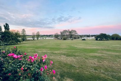 The view across the garden towards the sea at Brickworks and Vines, Isle of Wight