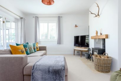 The living room with a log burner at Brickworks and Vines, Isle of Wight