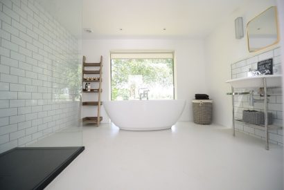 A large family bathroom with free standing bath at Brickworks and Vines, Isle of Wight