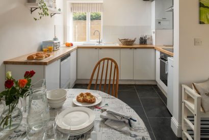 The dining table in the kitchen at The Milking Parlour, Wiltshire 