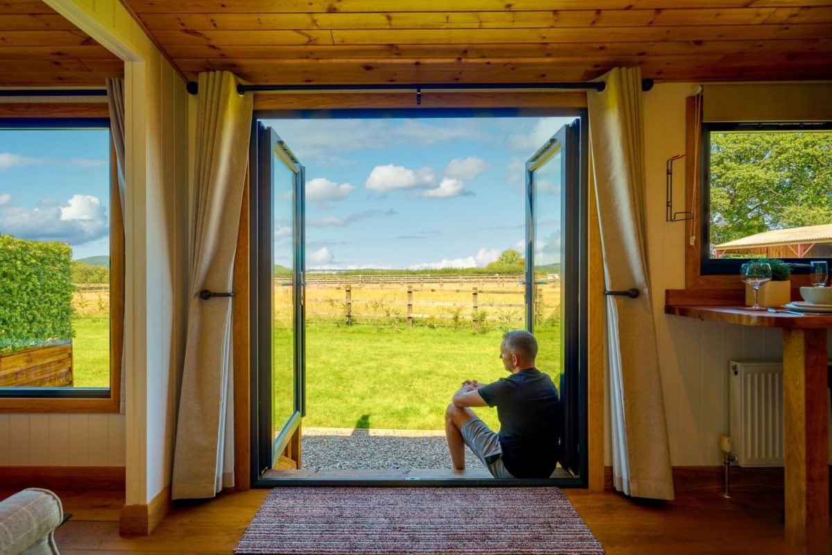 The double doors overlooking the countryside view at Abberley Shepherd's Hut, Worcestershire