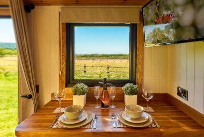 The breakfast bar with a countryside view at Abberley Shepherd's Hut, Worcestershire