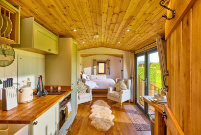 The kitchen and breakfast bar at Abberley Shepherd's Hut, Worcestershire