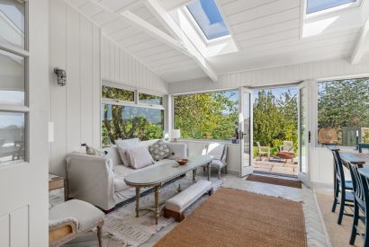 A seating area at Little Haven, Gower