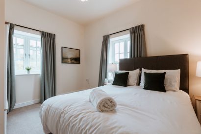 A king size bedroom at The Equestrians, Shropshire