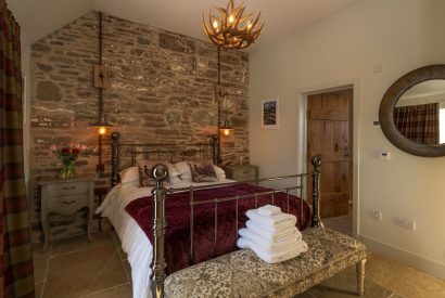 A king sized bedroom at Torran Steading, Perthshire