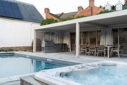 The hot tub and swimming pool area at White Exeter House, Devon