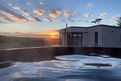The hot tub at sunset at Seascape House, Cornwall