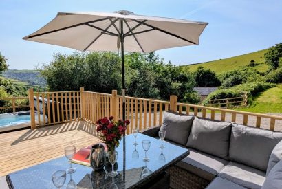 The sun deck and hot tub at Bracken Barn, Devon