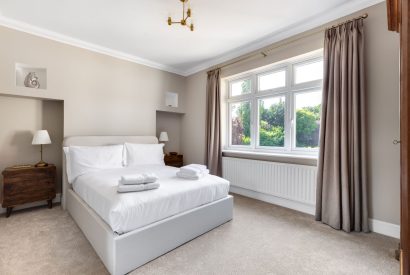 A king sized bedroom at Merry Manor, Essex