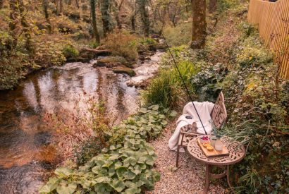 Seating by the river at The Enchanted Cottage, Cornwall