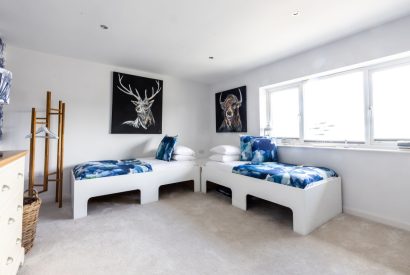 A twin bedroom at Tides Edge, Cornwall