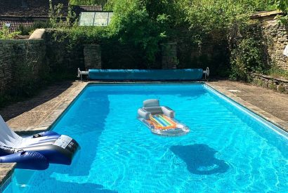 The heated outdoor swimming pool at Preedy's Cottage, Cotswolds