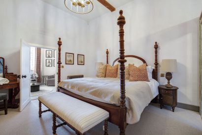 A super king-size bedroom at The Priory Gatehouses, Essex