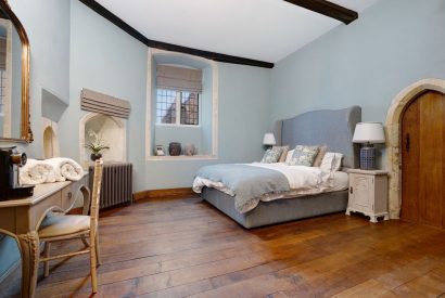 A king size bedroom at The Priory Gatehouses, Essex