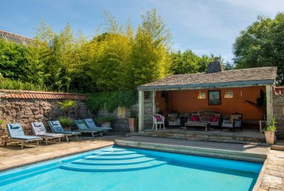 The heated outdoor swimming pool at Chulmleigh Manor, Devon