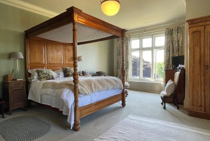 A four poster bedroom at Chulmleigh Manor, Devon