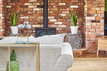The living room with fireplace at The Luxury Barn, Peak District
