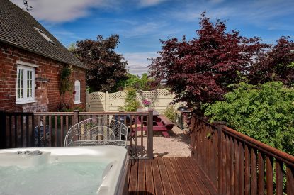 The hot tub and patio at The Luxury Barn, Peak District