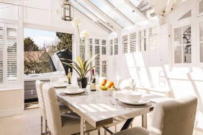 The dining table and kitchen at Rose Cottage, Isle of Wight