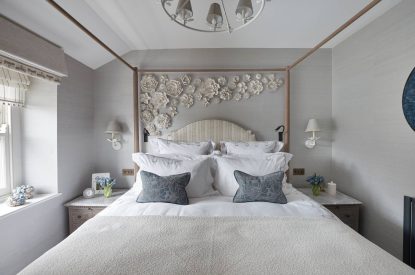 A bedroom with four poster bed at Beatrix Cottage, Lake District