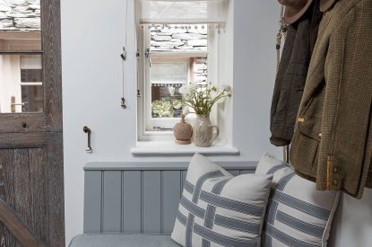 A bench seat in the cloakroom at Beatrix Cottage, Lake District