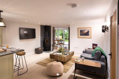 The living room with log burner at Shepherd's View, Lake District