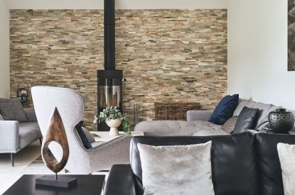 The living room with log burner at Munro Cabin, Loch Lomond