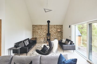 The living room with log burner at Stag Cabin, Loch Lomond