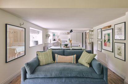 The sofa and kitchen at Bridlepath Cottage, North Wessex Downs