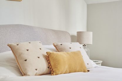 A bed at Ember Cottage, Cotswolds