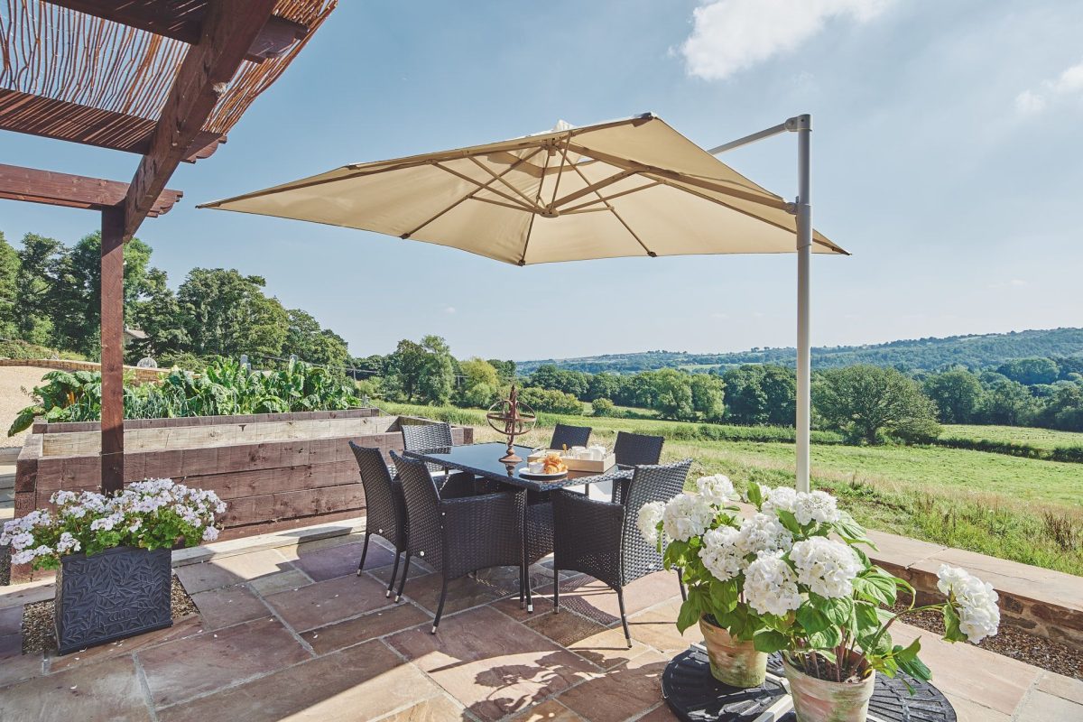 The outdoor dining table and view at Horseshoe House, Peak District