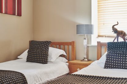 A twin bedroom at Buttermilk Barn, Peak District