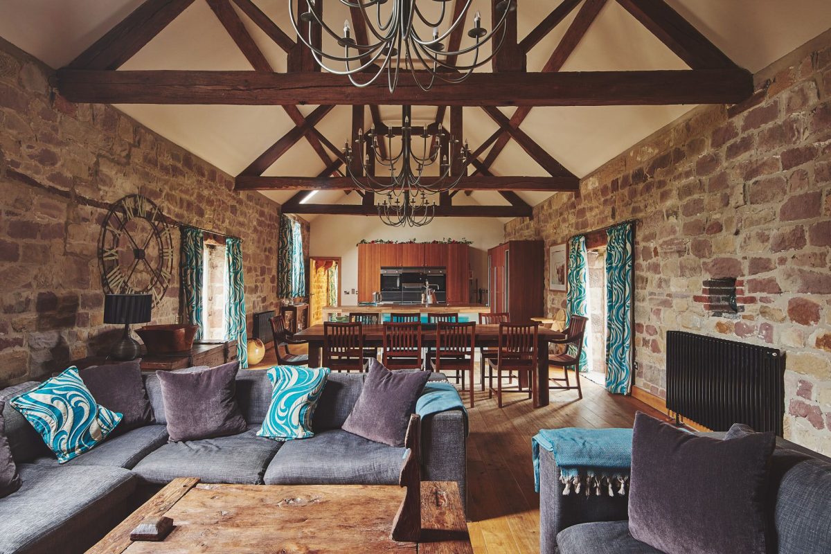 The open plan living room and kitchen at Woodpecker Loft, Peak District