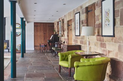 The sunroom with garden views at Heron House, Peak District
