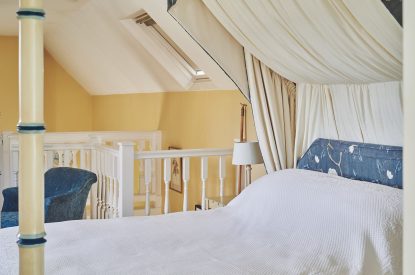 The four-poster bed at Kipling Cottage, Cotswolds
