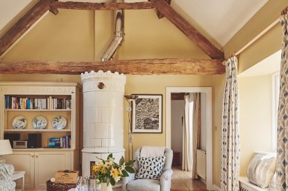 The living room and ceramic wood burner at Milton Cottage, Cotswolds