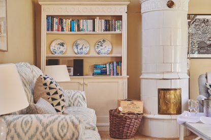 The living room with a wood burner at Milton Cottage, Cotswolds