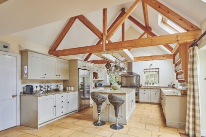 The kitchen with oak beams at Tennyson House, Cotswolds