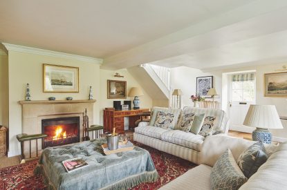 The living room with log burner at Blake Cottage, Cotswolds