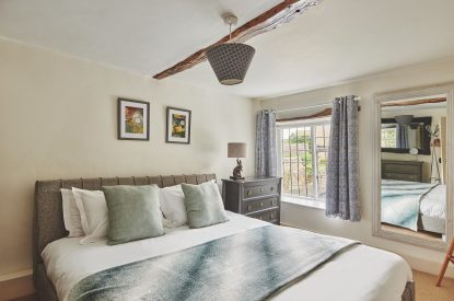 A bedroom at Crooked Cottage, Cotswolds