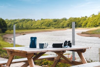 The outdoor dining area at Riverside Retreat, Devon